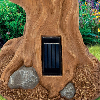 Bain d'oiseaux hibou avec lumière solaire