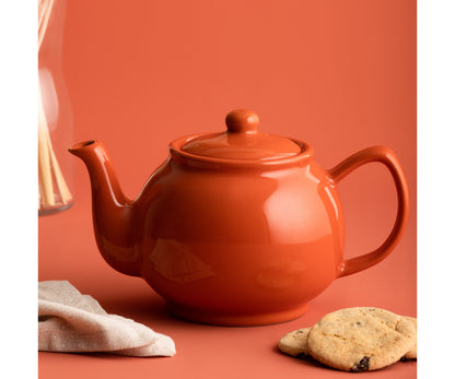 Sublimez votre thé avec notre théière 6 tasses orange brûlé